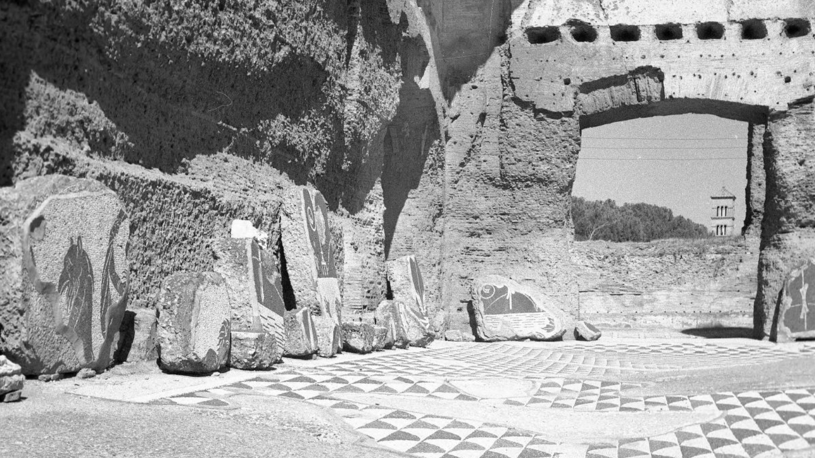 Black and white photographs of an ancient Roman ruins showing a brick wall and mosaic floor