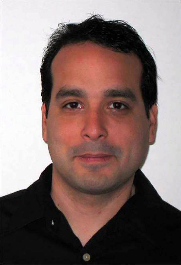 Jose D. Parral Jr. Passport photo of a light skinned man with brown hair looking at the camera