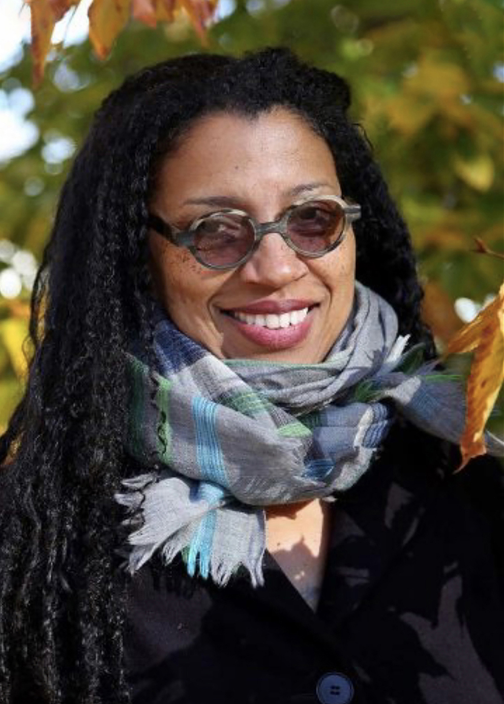 Robin Coste Lewis Color photograph of the head and shoulders of Robin Coste Lewis wearing a full, colorful scarf