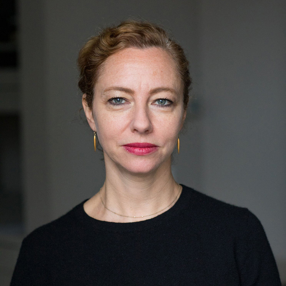 Sarah Ganz Blythe Color photo of head and shoulders of light skinned woman looking directly at the camera