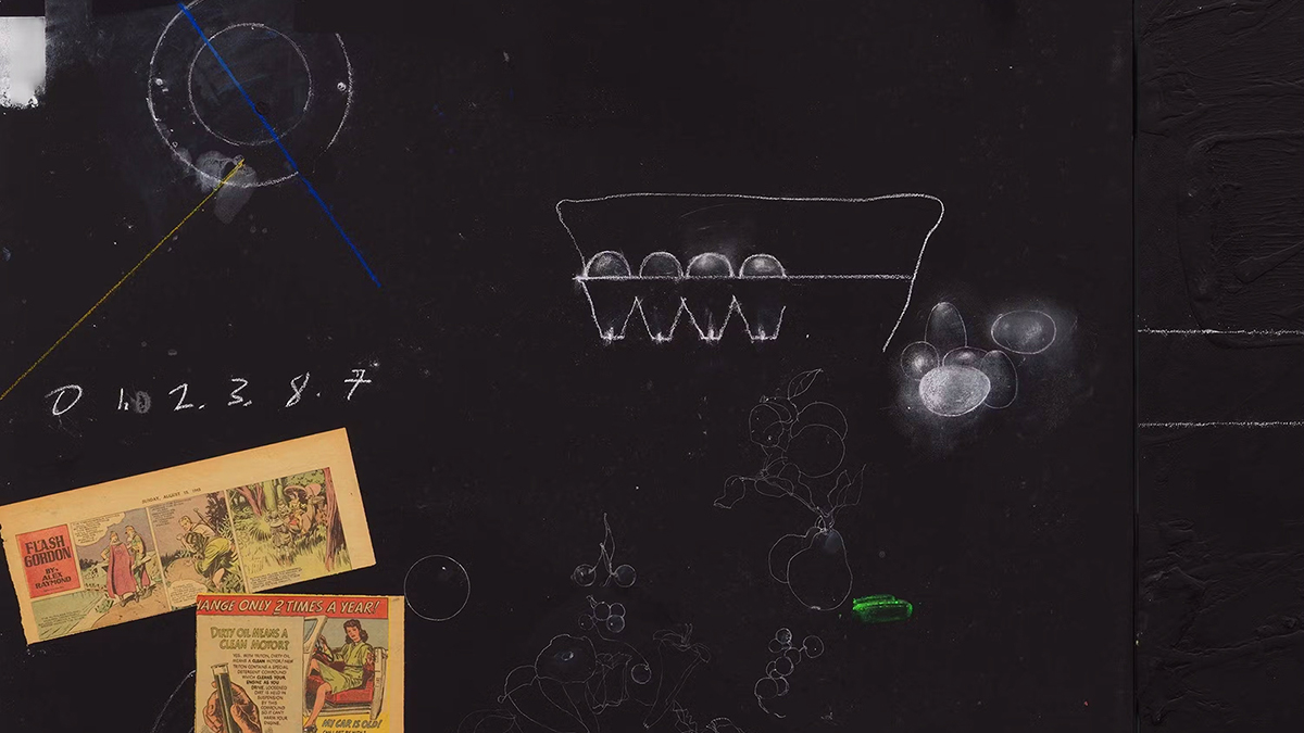 Color photo of a detail of a collage painting with comics on yellowed paper on a chalkboard slate background