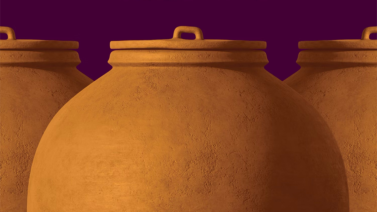 Detail of a book cover depicting the upper sections of three large ceramic vessals for liquid storage