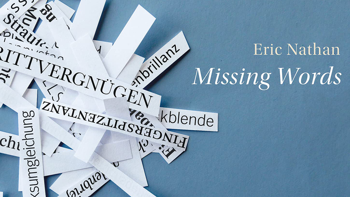 Detail of a CD cover with the composer's name (Eric Nathan) and title (Missing Words) in white letters on a blue background on the right; on the left are thin strips of white paper, with about half of them containing words in German