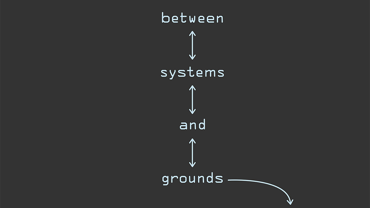 Detail of a record cover with white letters on a black background; the text reads between systems and grounds