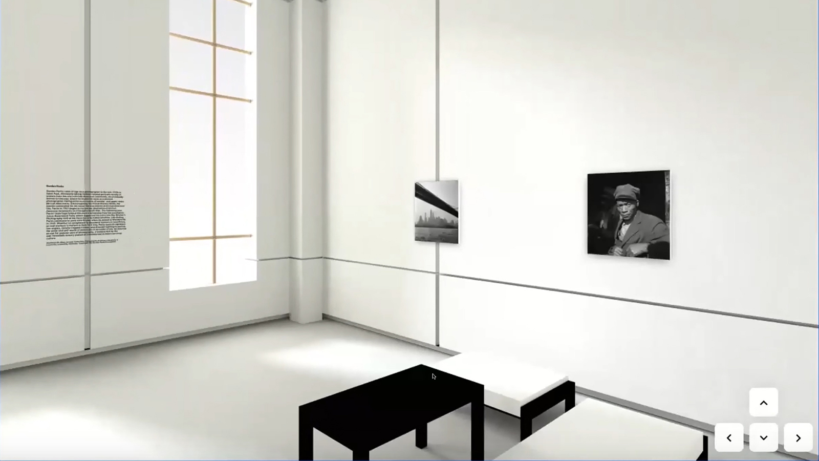 Screen shot of the presentation of a digital exhibition, showing photographs and benches in a virtual gallery space