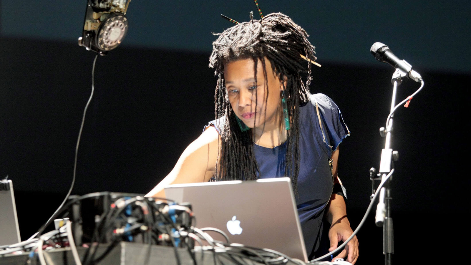 Color photograph of Pamela Z during a performance