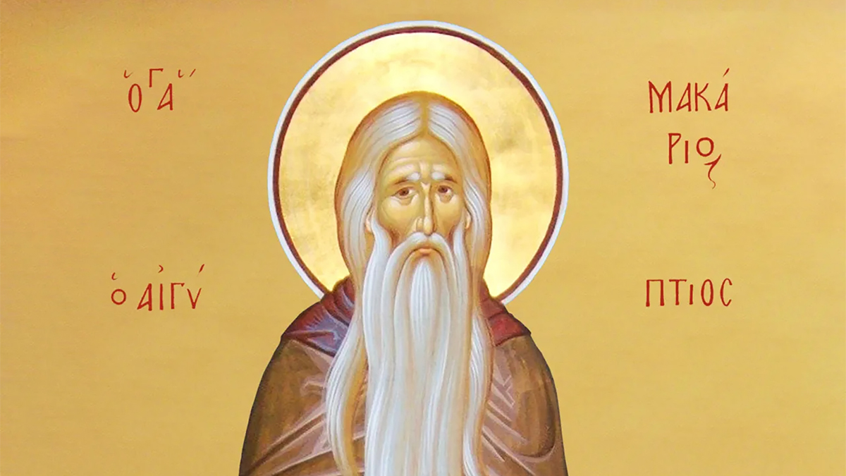 Color photo of a byzantine drawing depicting a light skinned man with a long white beard, with a golden halo