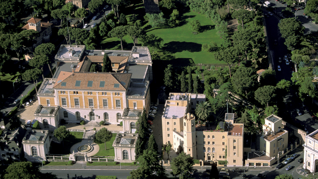 Color photograph that presents the aerial view of the McKim Mead & White Building and the Bass Gardens