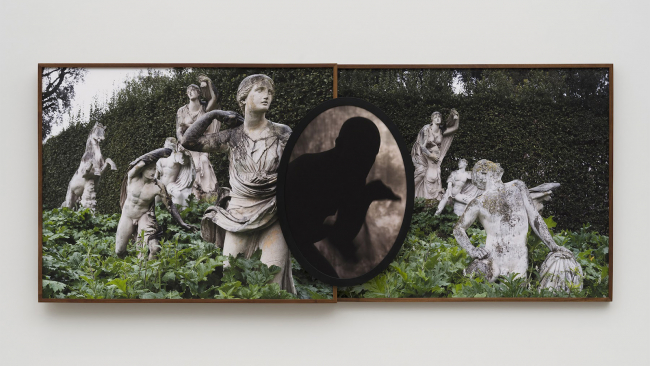 Color reproduction of a large photo collage showing statues in a garden and a human figure